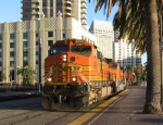 BNSF 4468 leads a train through town